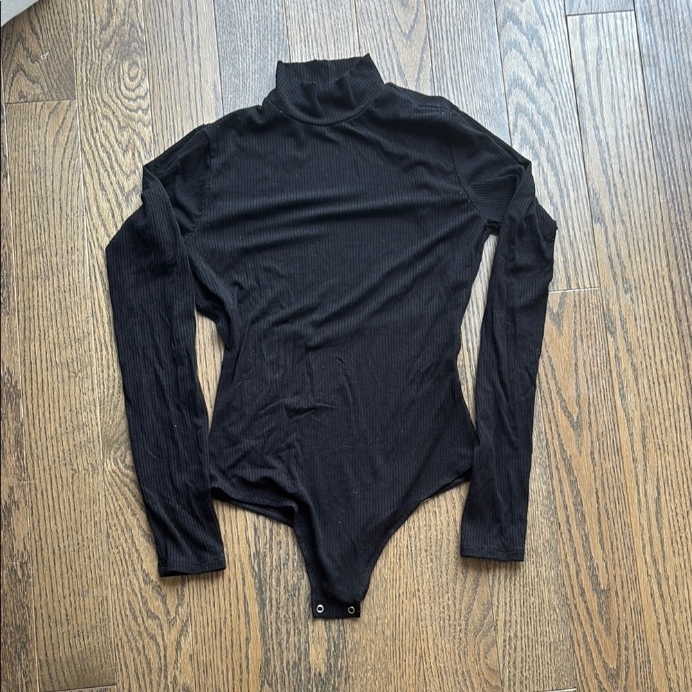 Garage Black Long Sleeve Bodysuit. Smoke and pet free home!